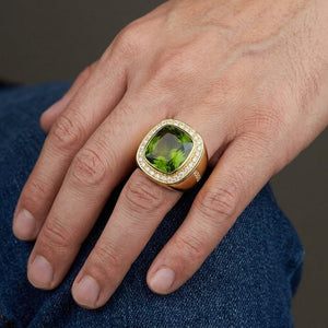 Natural Green Peridot Gold-Plated Silver Ring, worn on one middle finger in a natural hand close-up