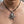Sculpted Octopus Sterling Silver Pendant, shown at the neck on an adult model; cord or chain is styling context