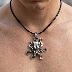 Sculpted Octopus Sterling Silver Pendant, shown at the neck on an adult model; cord or chain is styling context