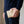 Pearl White Crocodile Tail Wallet held beside the hip