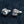 Purple Eye Claw Sterling Silver Stud Earrings shown in opposed claw pair detail view.