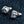 Purple Eye Claw Sterling Silver Stud Earrings shown in pair and backs top view.