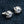 Purple Eye Claw Sterling Silver Stud Earrings shown in silver claws side view.