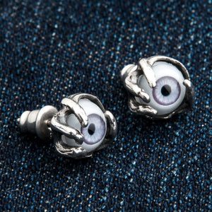 Purple Eye Claw Sterling Silver Stud Earrings shown in silver claws side view.