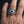 Muted purple evil eye sterling silver ring worn on a man's hand
