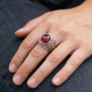 Red Cabochon Cupid Sterling Silver Ring worn on an adult hand, showing the face and shoulder detail.