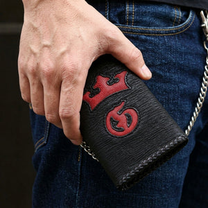 Red Crown Shark and Stingray Leather Biker Wallet, held closed at hip level