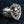 Red CZ Crowned Skull Sterling Silver Ring. Crown left scroll angle.