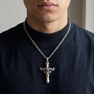 Red CZ Fleur-de-Lis Sterling Silver Cross Pendant styled on a silver chain with a dark shirt