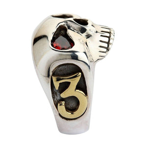 Red CZ Skull Silver Ring with Gold Accents. Gold three profile.