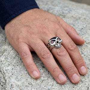 Red CZ Skull Silver Ring with Gold Accents worn on an adult hand.