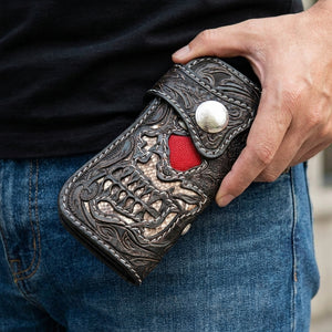 Red-Eye Demon Skull Leather Biker Wallet, held in hand