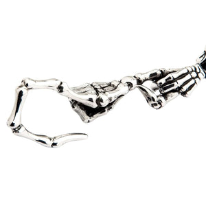 Red-Eye Skeleton Skull Sterling Silver Keychain showing close detail of the bone-shaped attachment hook.