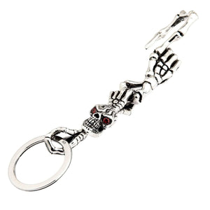 Red-Eye Skeleton Skull Sterling Silver Keychain showing full skeletal hand, red-eyed skull, bone hook and lower ring.