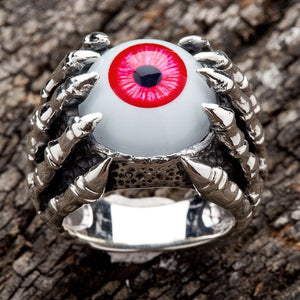 Red Eyeball Claw Sterling Silver Ring, front view of silver gothic ring with red eyeball gripped by dragon claws