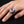 Red Eyeball Skeleton Claw Sterling Silver Ring, worn on an adult model