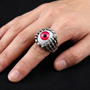 Red Eyeball Skeleton Claw Sterling Silver Ring, worn on an adult model