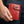 Red Floral Hand-Tooled Leather Trifold Wallet, held closed with top grommet visible