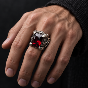 Red garnet dragon claw sterling silver ring worn on hand