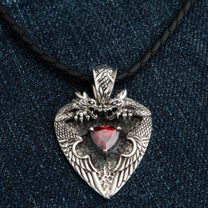 Red Garnet Twin Dragon Heart Sterling Silver Pendant, the heavy sterling silver twin dragon heart pendant with a red garnet shown on a