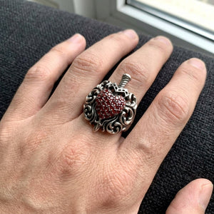 Garnet Heart Dagger Sterling Silver Ring worn on a hand