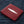 Red Pearl Stingray Bifold Wallet showing the red pearl-marked panel viewed diagonally.