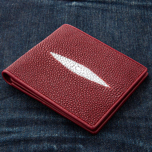Red Pearl Stingray Bifold Wallet showing the red pearl-marked panel viewed diagonally.