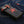 Red Snakeskin Star Black Leather Biker Wallet, front diagonal denim