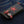 Red Snakeskin Star Black Leather Biker Wallet, front oblique denim