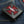 Red Stingray Cross Black Bifold Wallet, front right angle
