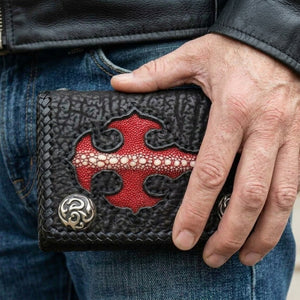 Red Stingray Cross Shark Leather Trifold Wallet, held in hand