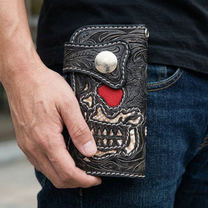 Skull Stingray and Cobra Leather Long Biker Wallet, held at hip level