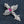 Red Stone Winged Cross Sterling Silver Pendant, feathered wing angle