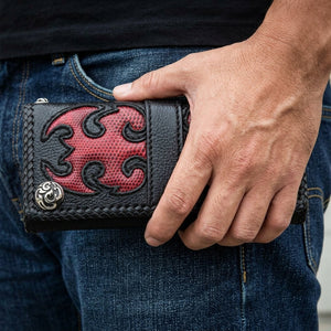 Red Tribal Komodo Leather Biker Wallet, held at hip level