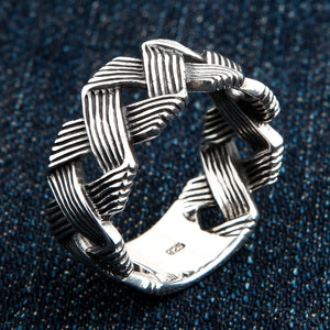 Openwork Wave Weave Sterling Silver Band Ring shown in wave weave on denim view.