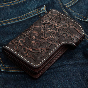 Ride to Live Brown Leather Cross & Skull Wallet showing the reverse skull and leather tooling viewed diagonally.