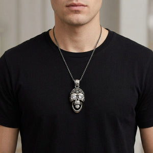 Rider skull silver pendant with clear eye stones worn over a black shirt; chain shown for styling