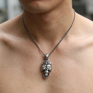 Clear Eye Rider Skull Sterling Silver Pendant, shown at the neck on an adult model; cord or chain is styling context
