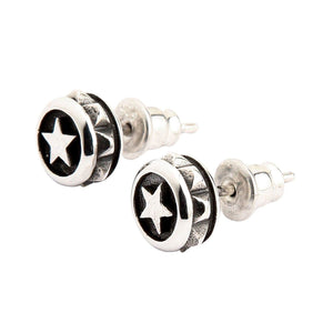 Round Star Stud Earrings in Sterling Silver. The angled pair shows the raised stars and textured disc edges.