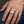 Royal Flush of Spades Sterling Silver Ring, worn on one middle finger in a natural hand close-up