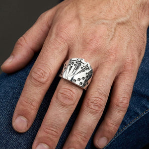 Royal Flush of Spades Sterling Silver Ring, worn on one middle finger in a natural hand close-up