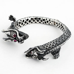 Ruby Eye Double Dragon Sterling Silver Cuff. Dragon head side angle.