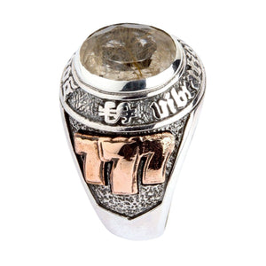 Copper 777 numbers beneath the oval rutilated quartz setting