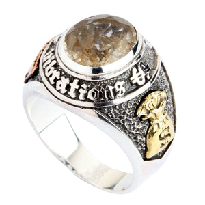 Close angle of the rutilated quartz, engraved silver bezel and brass shoulder