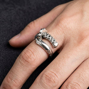 Samurai sword silver ring worn on a hand