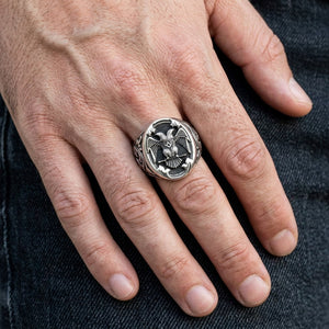 Scottish Rite Double-Headed Eagle Silver Ring, worn on one middle finger in a natural hand close-up