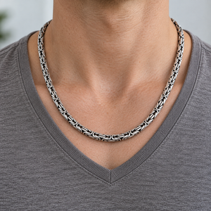 7mm Byzantine Sterling Silver Statement Necklace around the neckline of a grey V-neck shirt.