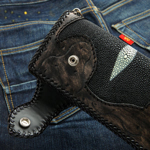 Dragon Concho Stingray & Tooled Leather Wallet showing the dragon closure strap lifted away from the snap.