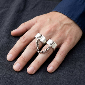 Chained Double Sterling Silver Handcuff Ring worn on an adult hand.