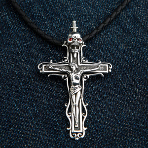 Skull Crucifix Sterling Silver Pendant with Garnet Eyes, cord flatlay